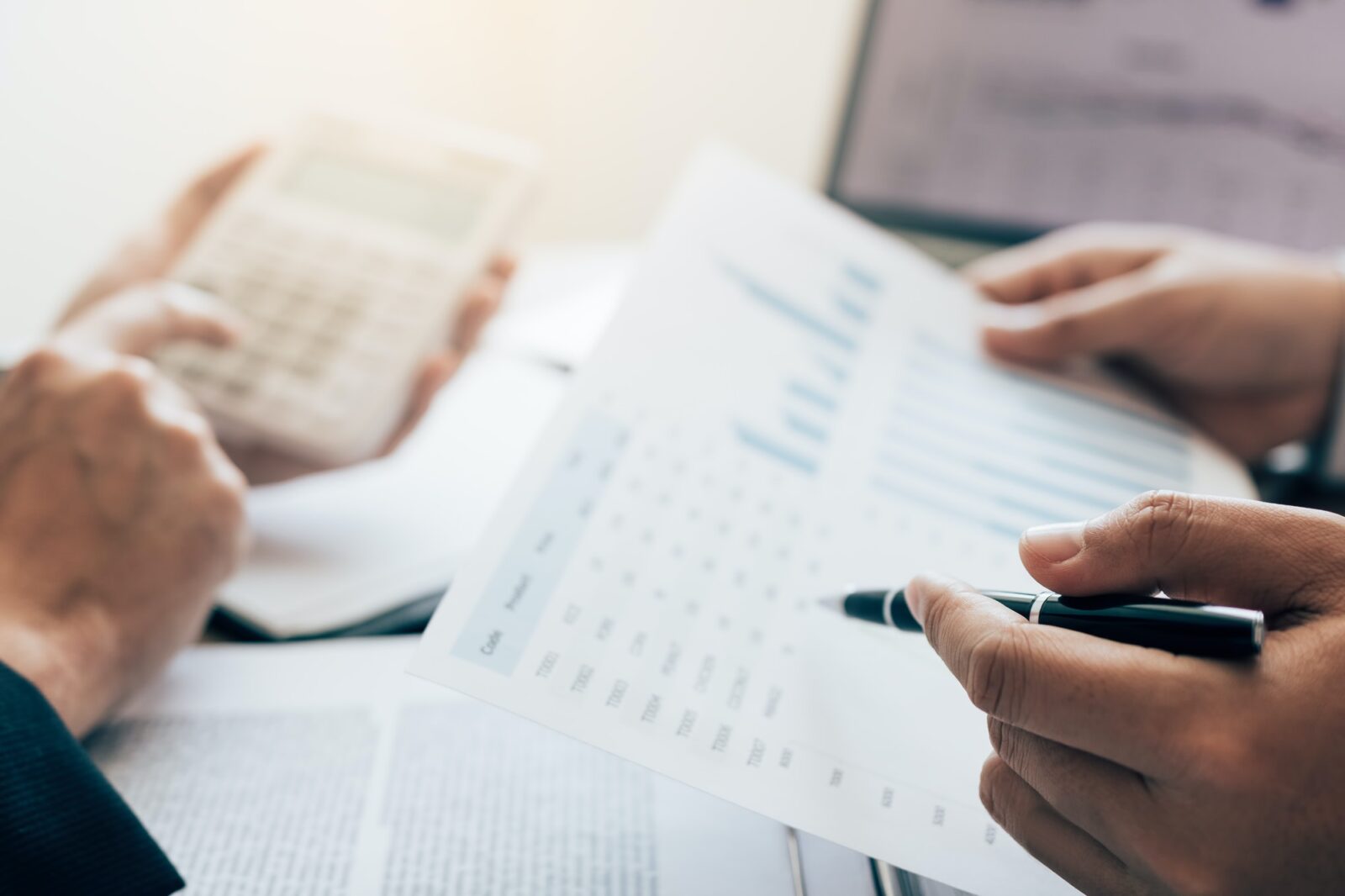 Business people pointing on statistic number result and analysis finance cost