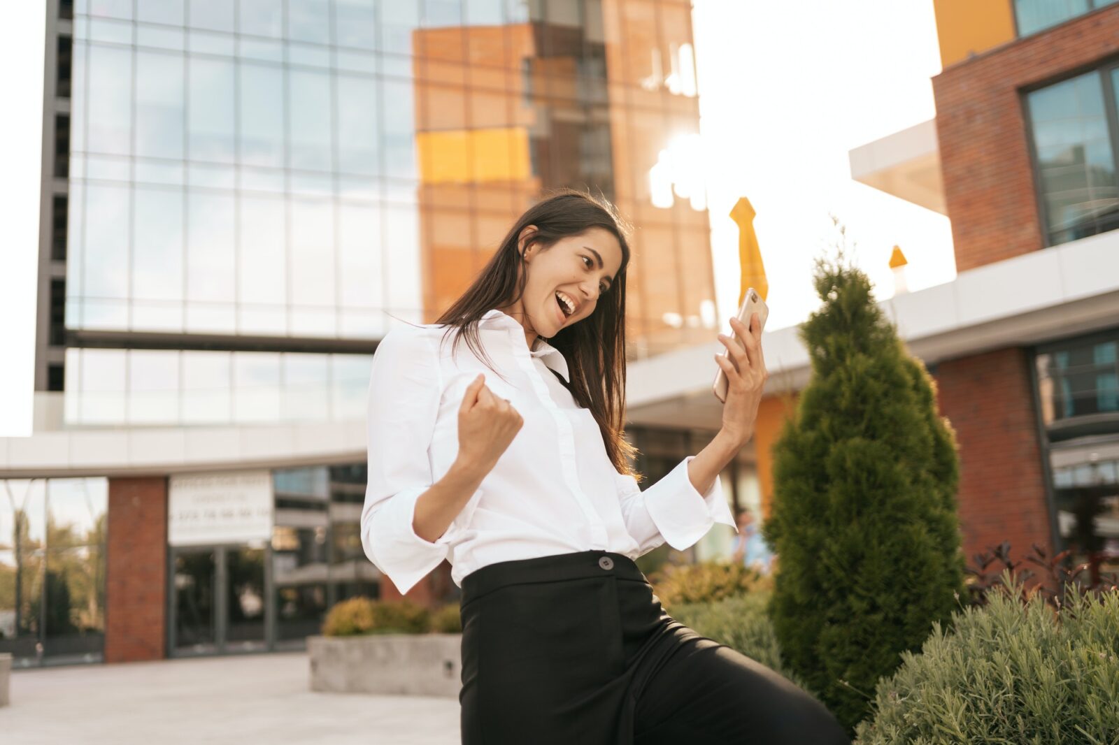 Rearview of businesswoman enjoying her great results