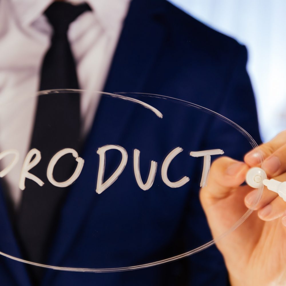 Smart business man writing the word Product on the mirror board - Product text.