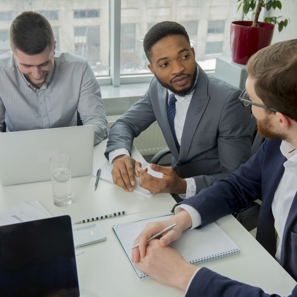 Young multiracial business team working process in office